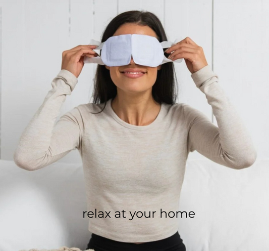 Woman wearing a sleep mask with text 'relax at your home' on a white background